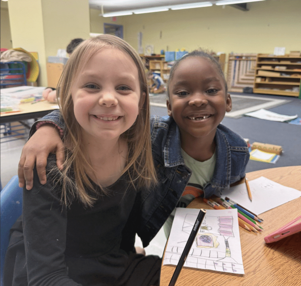 girls smiling in a classroom